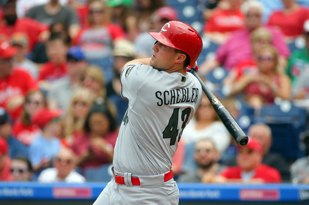 Scott Schebler follows through on his swing.