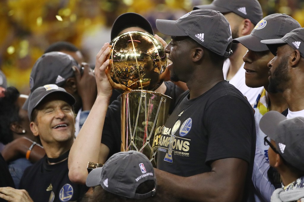 The Warriors celebrate after beating the Cavs.
