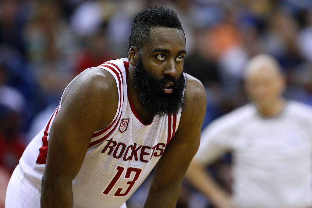 James Harden looks on during the game.