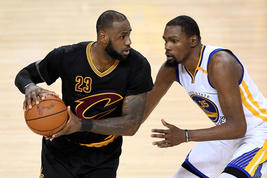 LeBron James looks to drive on Kevin Durant.