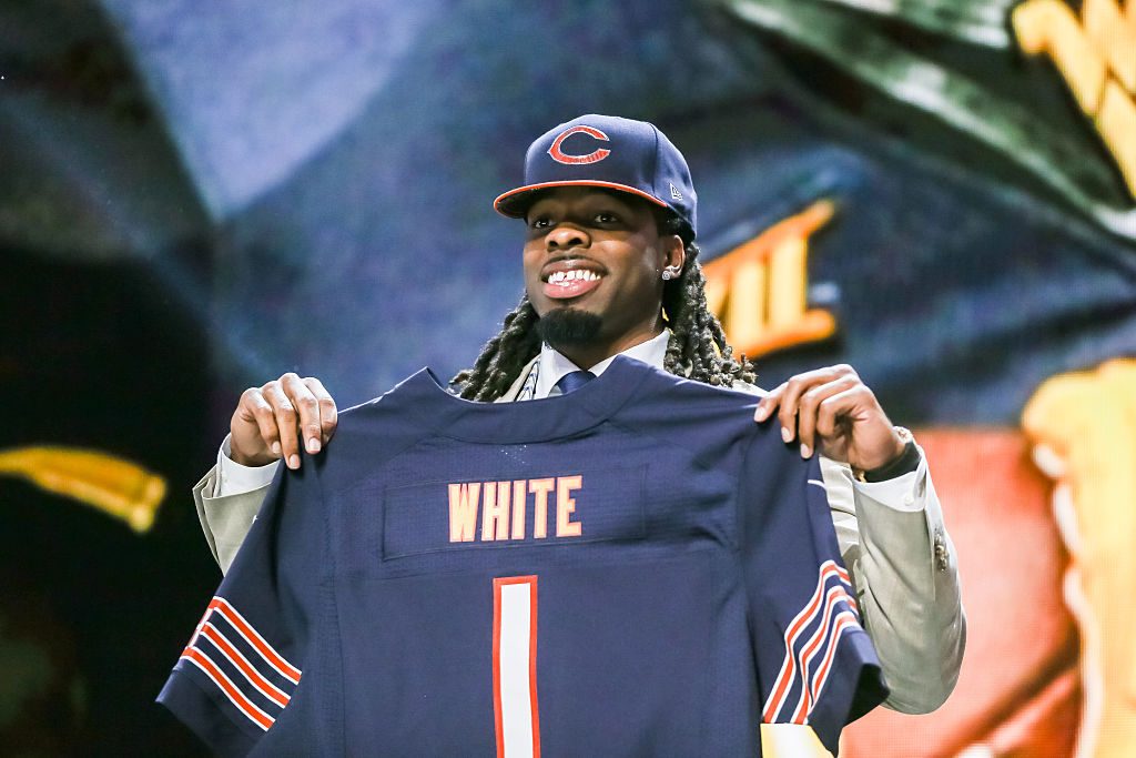 Kevin White of the West Virginia Mountaineers holds up his new jersey.