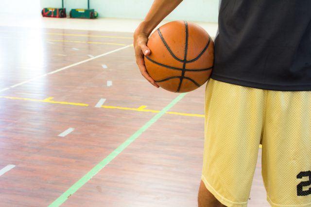 Player with basketball ball in gym. Player with basketball ball in gym.