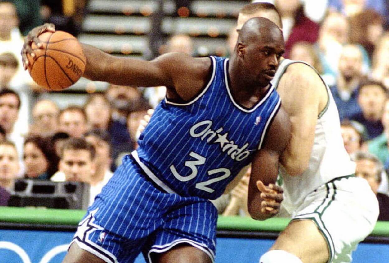 Shaquille O'Neal backs down a defender during his time with the Orlando Magic.
