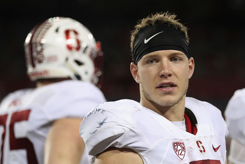 Running back Christian McCaffrey of the Stanford Cardinal talks on the sideline.