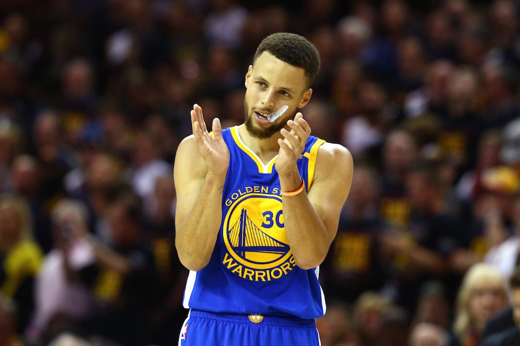 Stephen Curry reacts to a play.