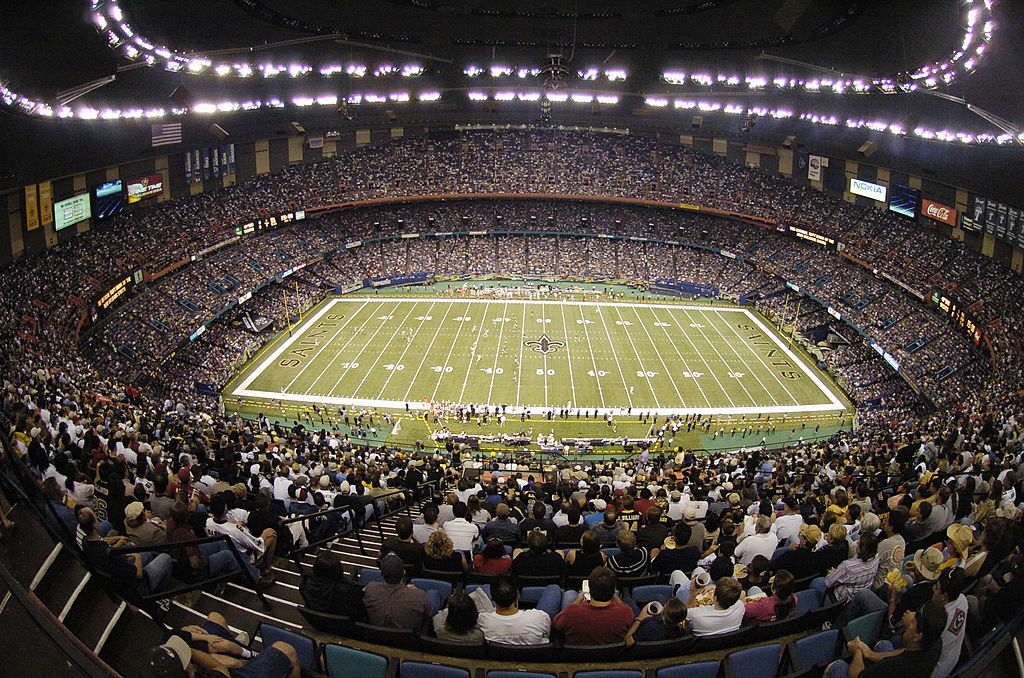 Fans sit in their seats at the Mercedes-Benz Superdome, waiting for a Saints game to begin.