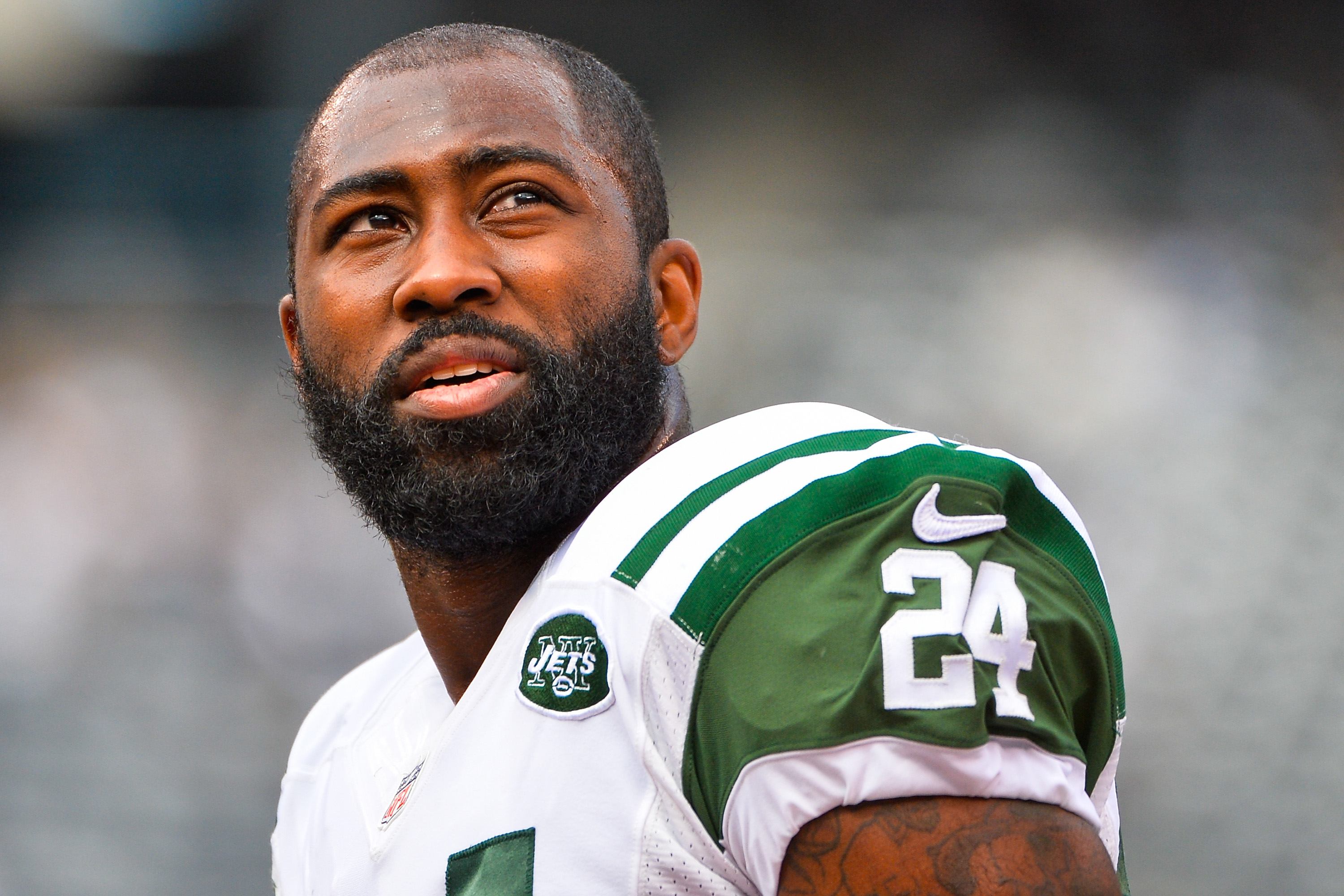 Darrelle Revis #24 of the New York Jets looks on before a game.
