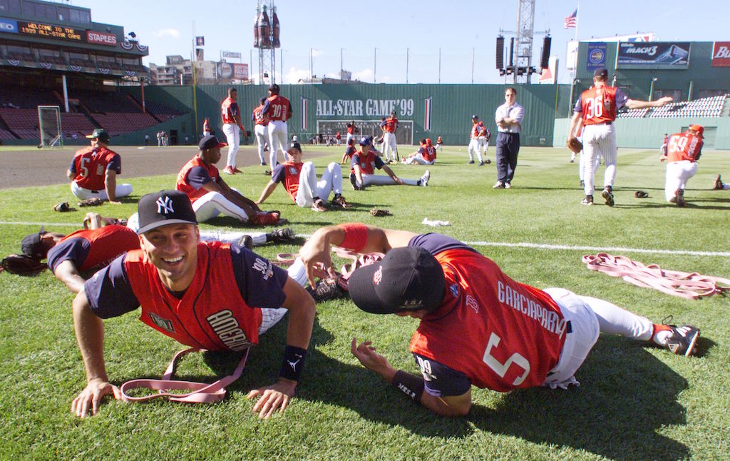 Derek Jeter and Nomar Garciaparra stretch during batting practice.