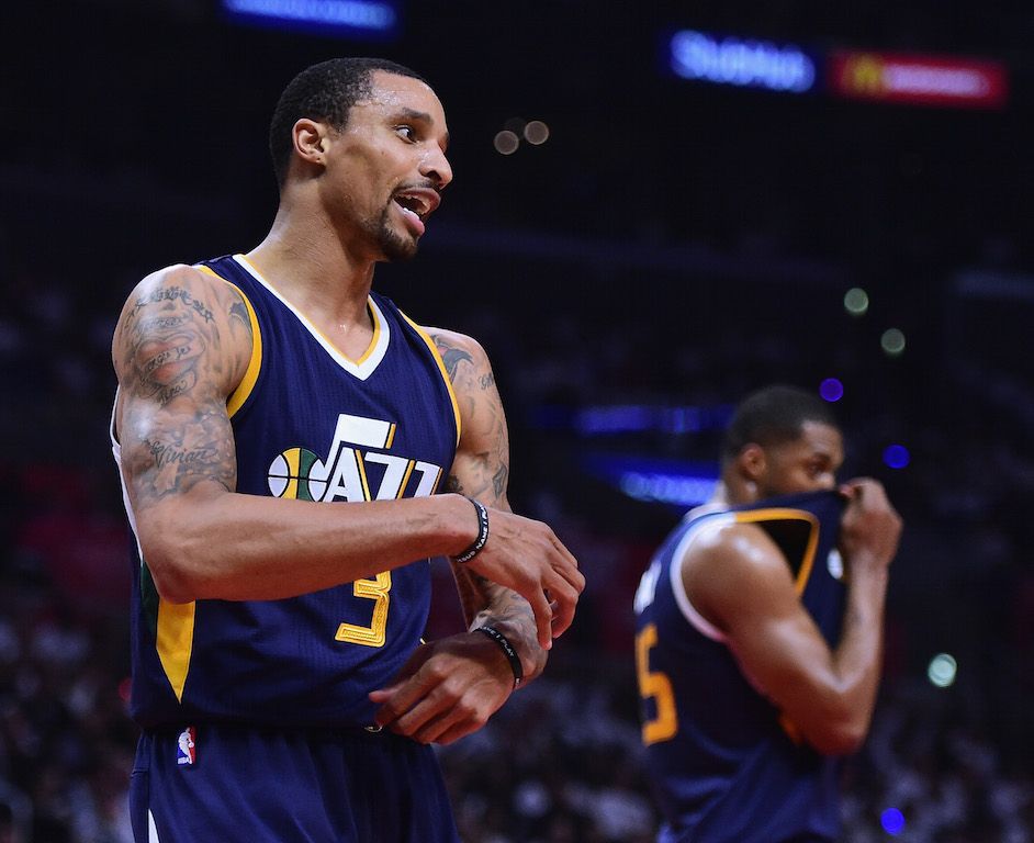 George Hill looks for a foul.