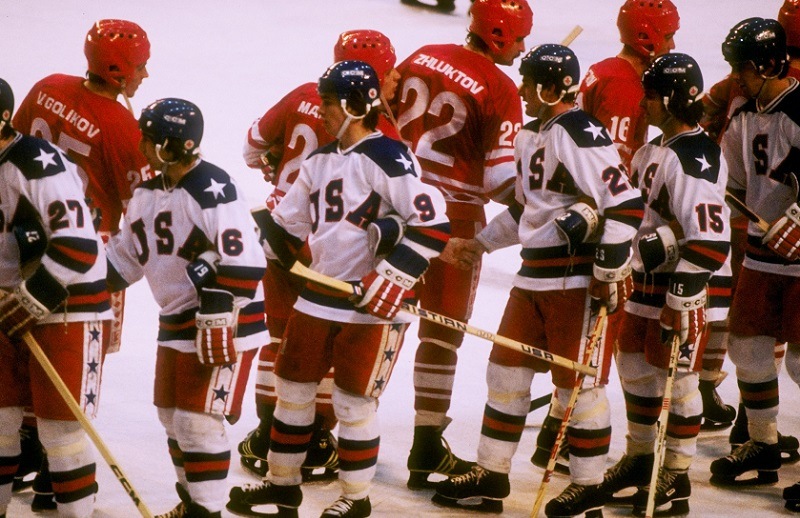 The teams from the United States and the Soviet Union shake hands after the semifinal hockey game during the Winter Olympics.