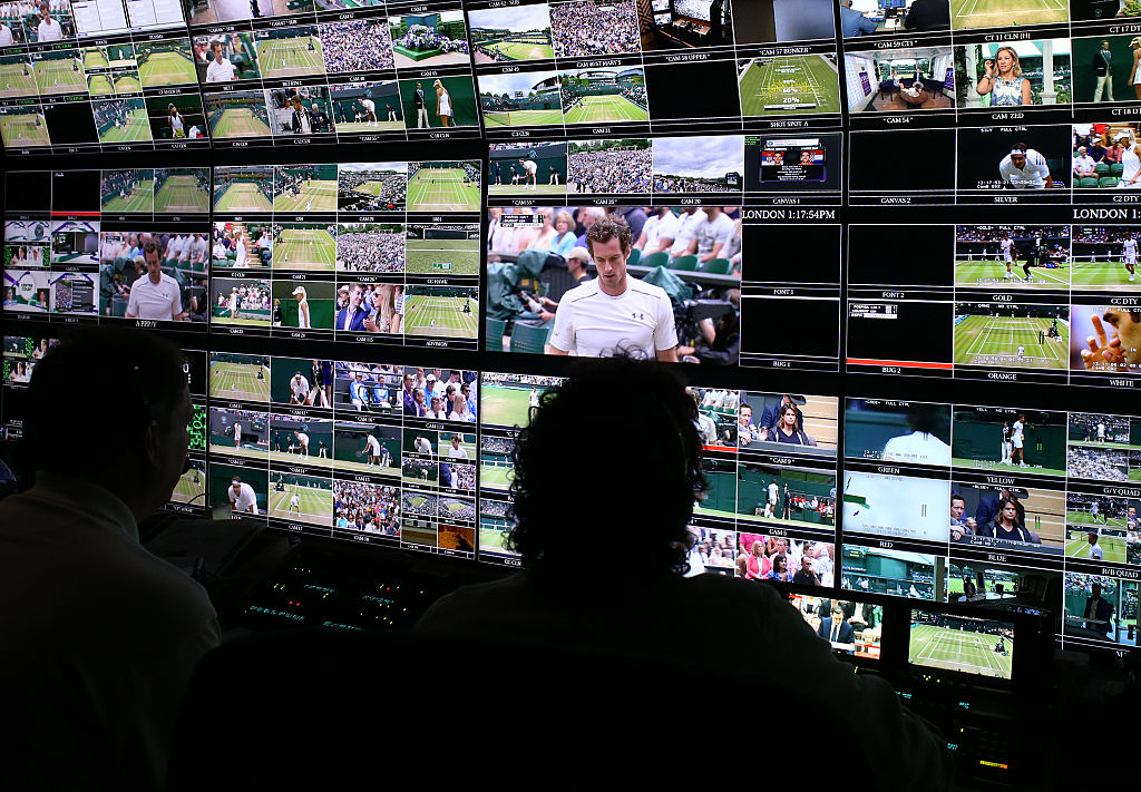 Production staff view screens in an ESPN operation room during Wimbledon.