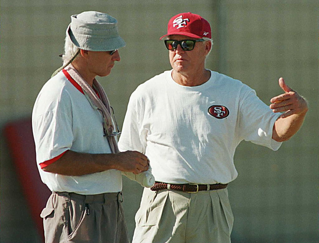 Bill Walsh talks with a San Francisco 49ers coach.