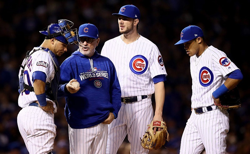 Joe Maddon stands on the mound, making pitching changes in Game 4 of the 2016 World Series.