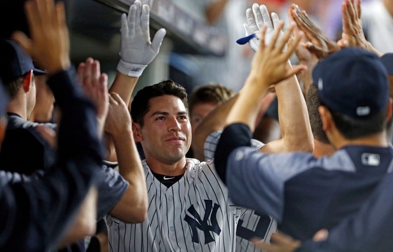 Jacoby Ellsbury of the New York Yankees celebrates hitting a grand slam home run.