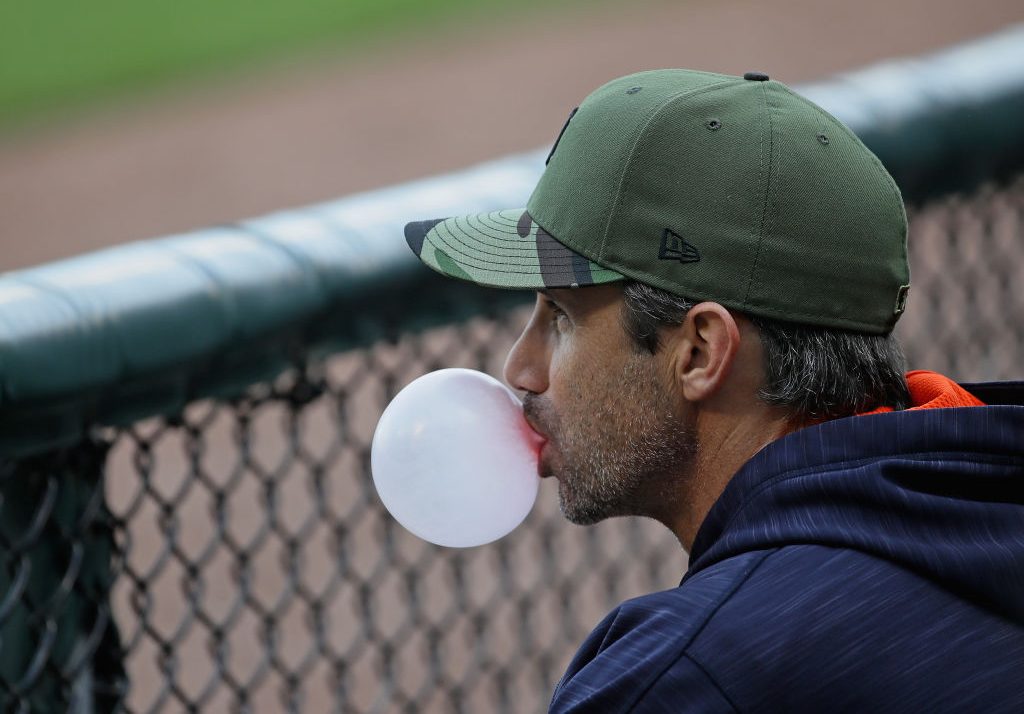 Manager Brad Ausmus #7 of the Detroit Tigers blows a bubble as he watches his team.