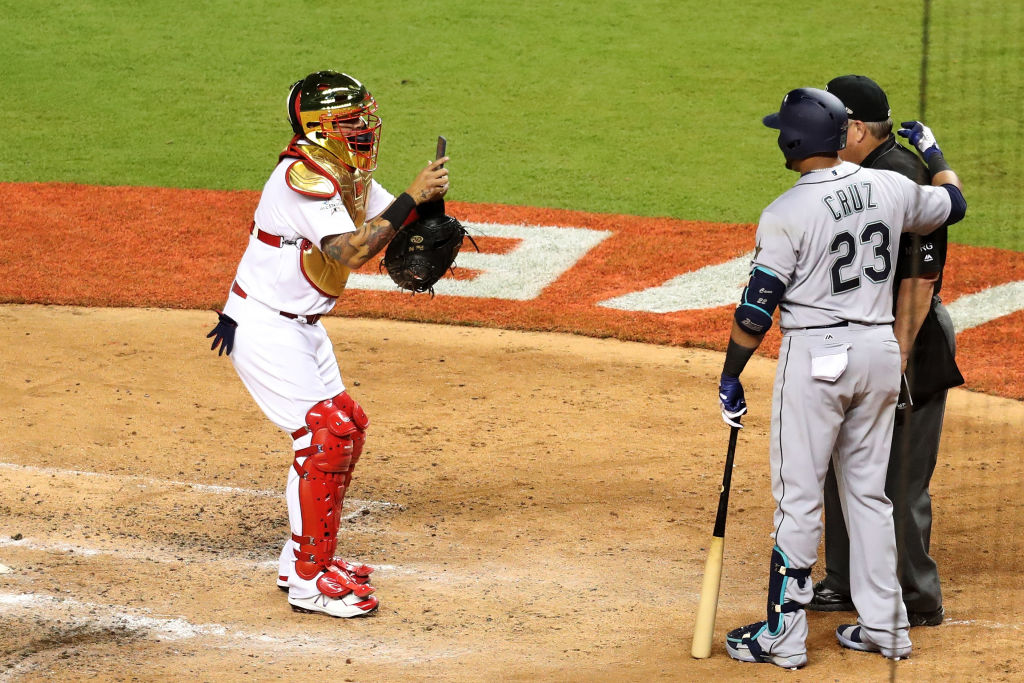 Nelson Cruz and Joe West pose for a picture, taken by Yadier Molina.