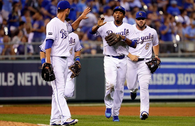 Alcides Escobar and Mike Minor celebrate during a game at Kauffman Stadium.