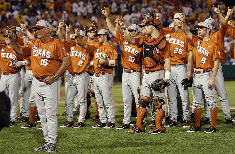 The Texas Longhorns celebrate a win with fans during the 2009 NCAA College World Series.