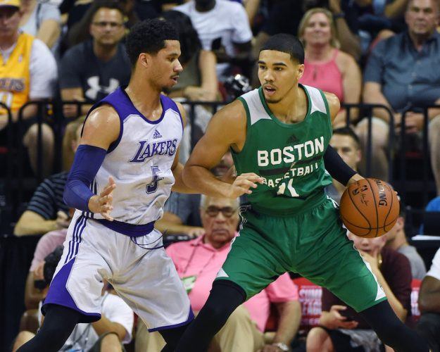 Jayson Tatum backs down a defender. Jayson Tatum goes to work in the post.
