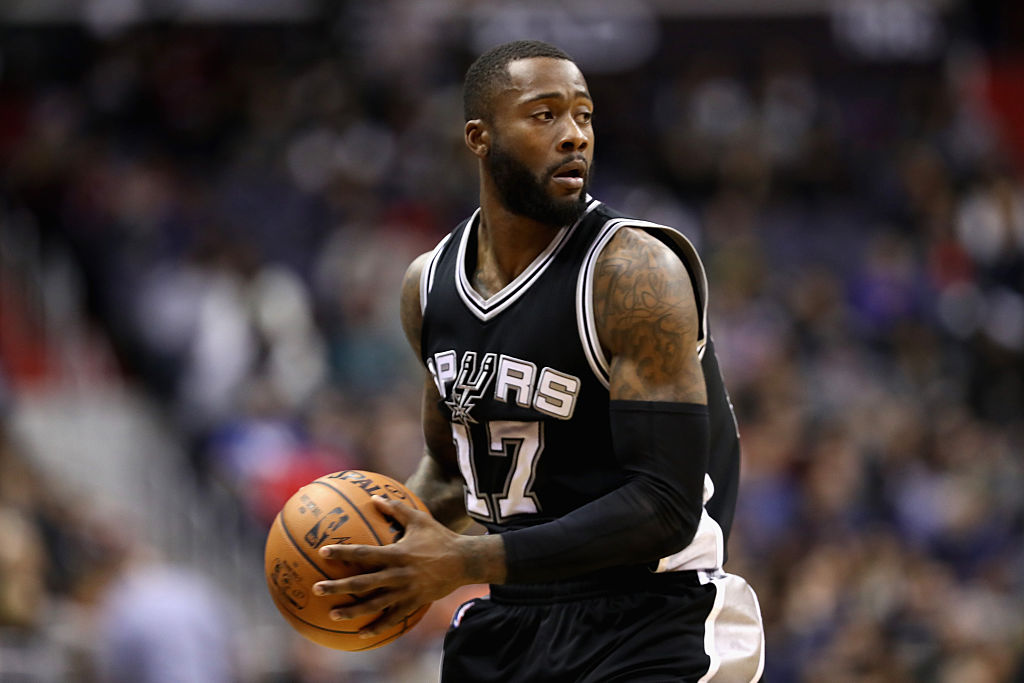 Jonathon Simmons of the San Antonio Spurs looks to pass.