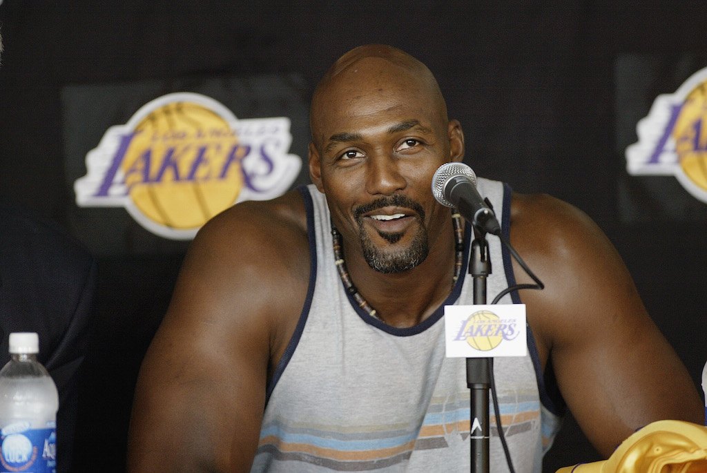 Karl Malone talks to the media after signing with the Lakers.