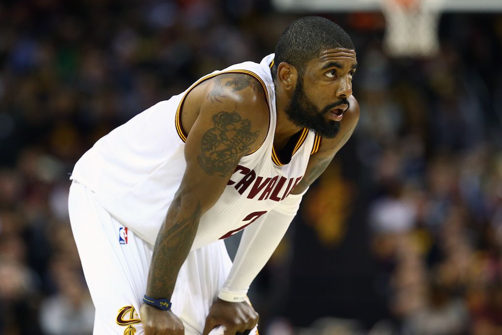 Kyrie Irving gets ready for the play. Kyrie Irving looks on during the NBA Finals.