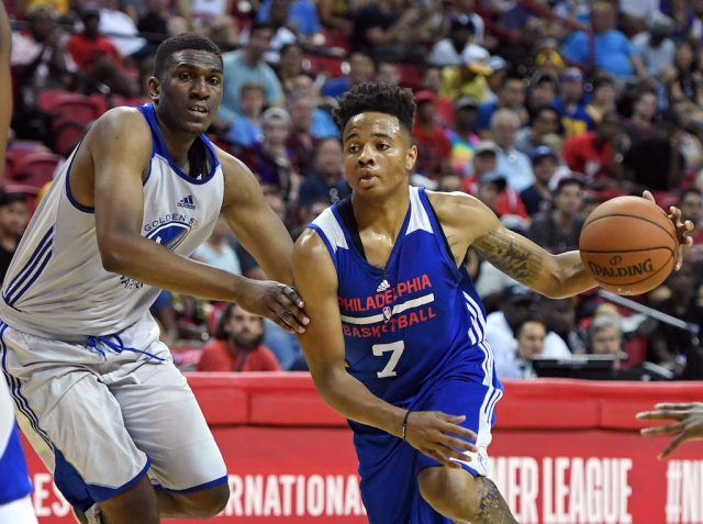 Markelle Fultz gets by the defender. Markelle Fultz drives to the bucket.