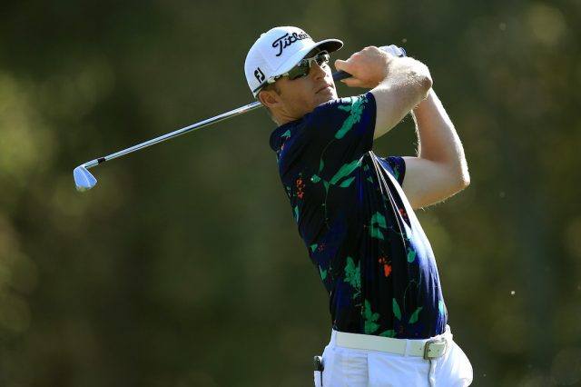 Morgan Hoffmann hits off the tee. Morgan Hoffmann tees off.