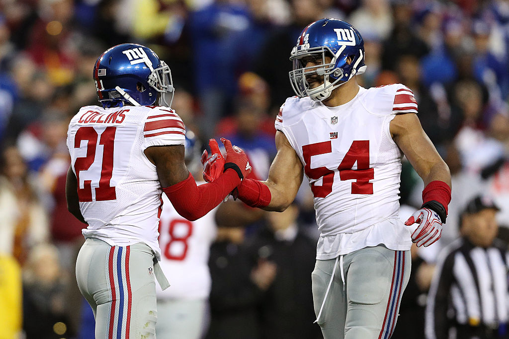 Strong safety Landon Collins #21 of the New York Giants high fives Olivier Vernon.