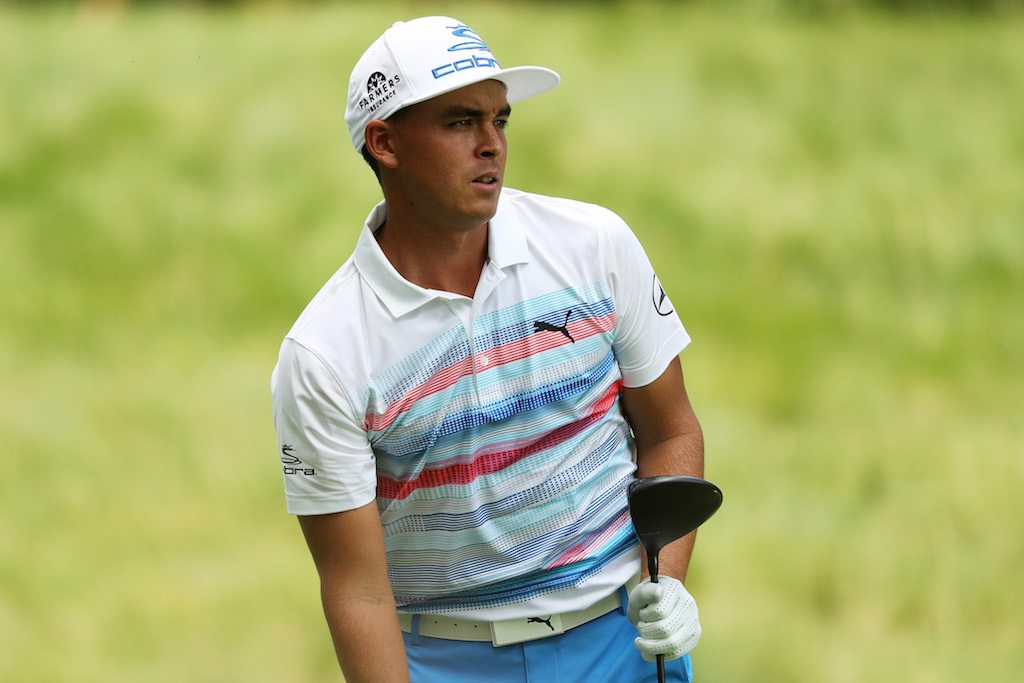 Rickie Fowler plays a shot at the Quicken Loans National.