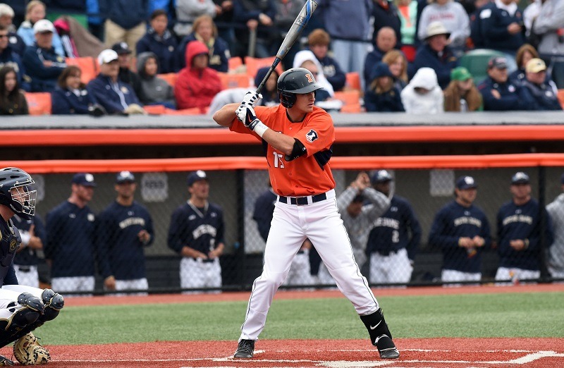A Fighting Illini baseball player prepares to bat.