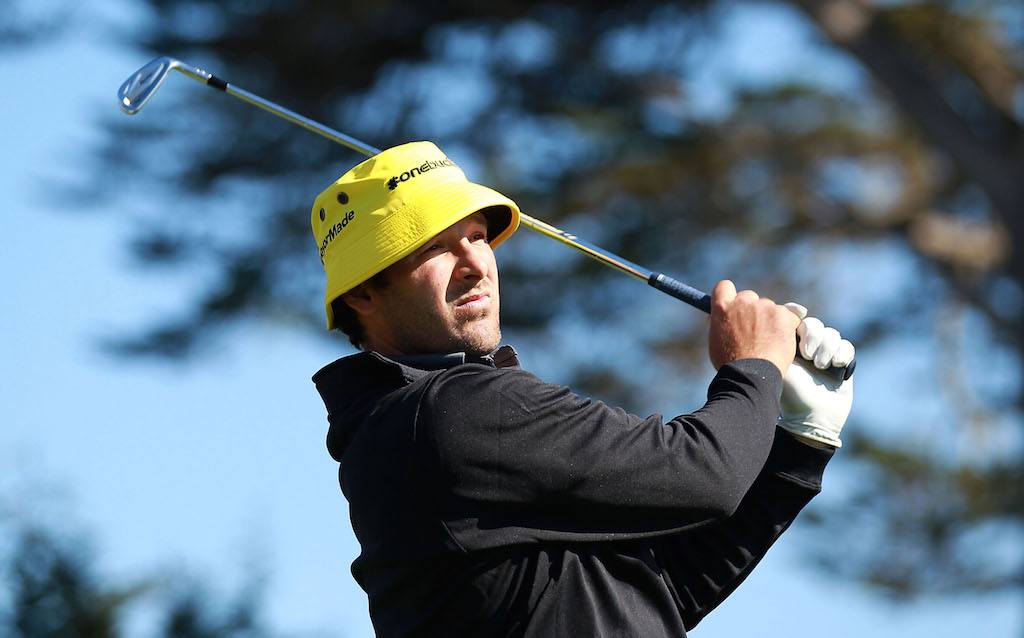 Tony Romo hits a shot.