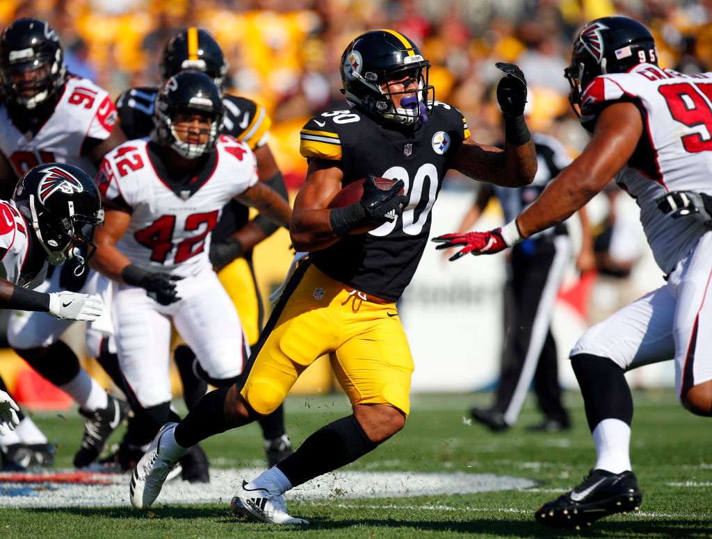 James Conner #30 of the Pittsburgh Steelers rushes against the Atlanta Falcons