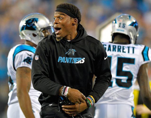 Cam Newton is having fun out there. Cam Newton smiles during the preseason.