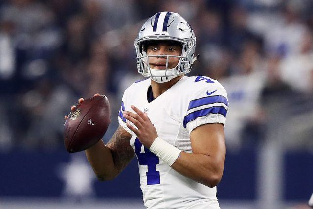 Dak Prescott looks to throw. Dak Prescott keeps his eyes down the field.