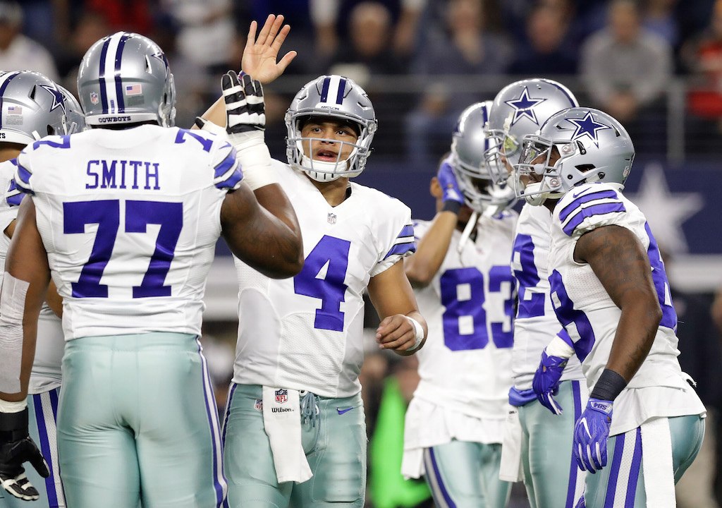 Dak Prescott celebrates with his teammates in the huddle. Dak Prescott celebrates with his teammates in the huddle.