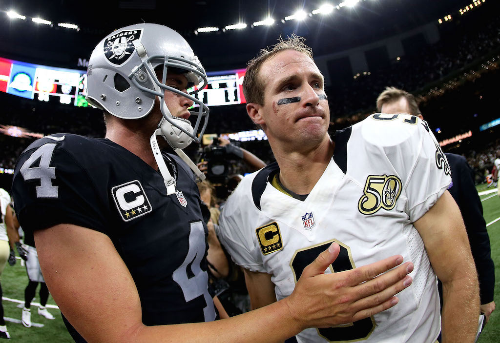 Derek Carr and Drew Brees meet after the game.