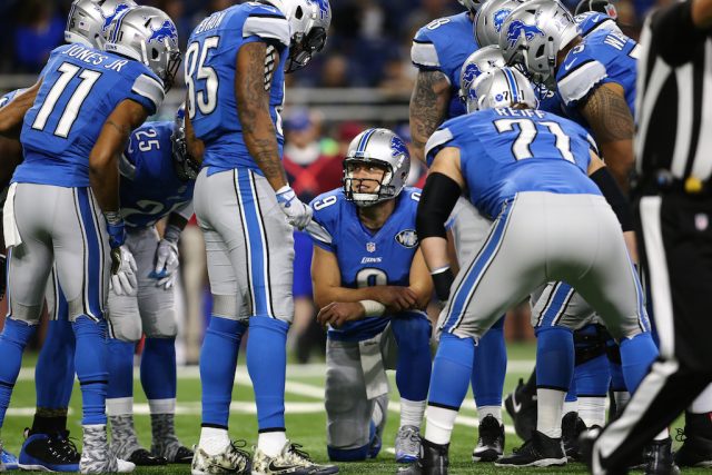 All eyes are on Matthew Stafford. Matthew Stafford leads the Lions huddle.