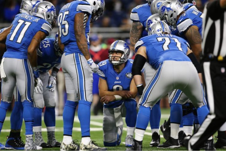 Matthew Stafford leads the Lions huddle.