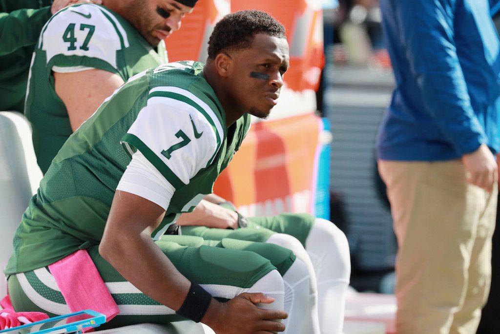 Geno Smith looks on from the bench. Geno Smith rides the pine.