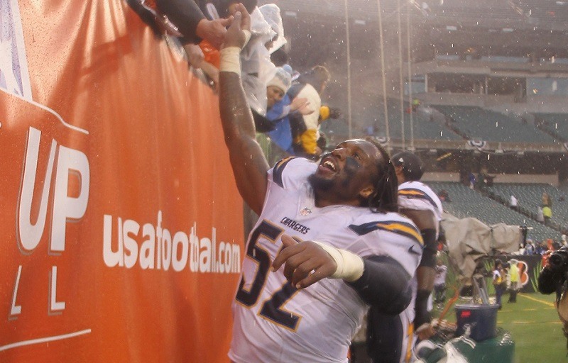 Reggie Walker #52 of the San Diego Chargers celebrates a victory.