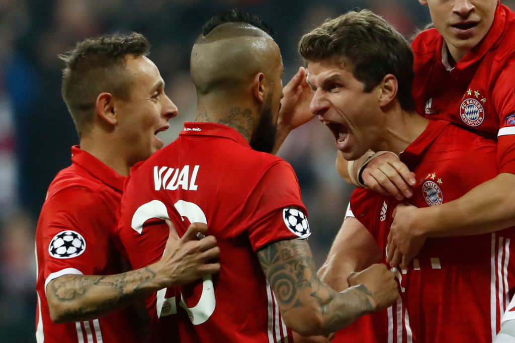 Bayern Munich's forward Thomas Mueller celebrate scoring a goal with his teammates.