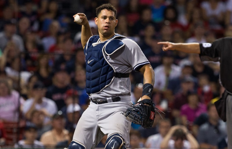 BOSTON, MA - JULY 15: Gary Sanchez #24 of the New York Yankees motions to throw the ball to first base during the fifteenth inning of a game against the Boston Red Sox at Fenway Park on July 15, 2017 in Boston, Massachusetts. The Yankees won 4-1 in sixteen innings.