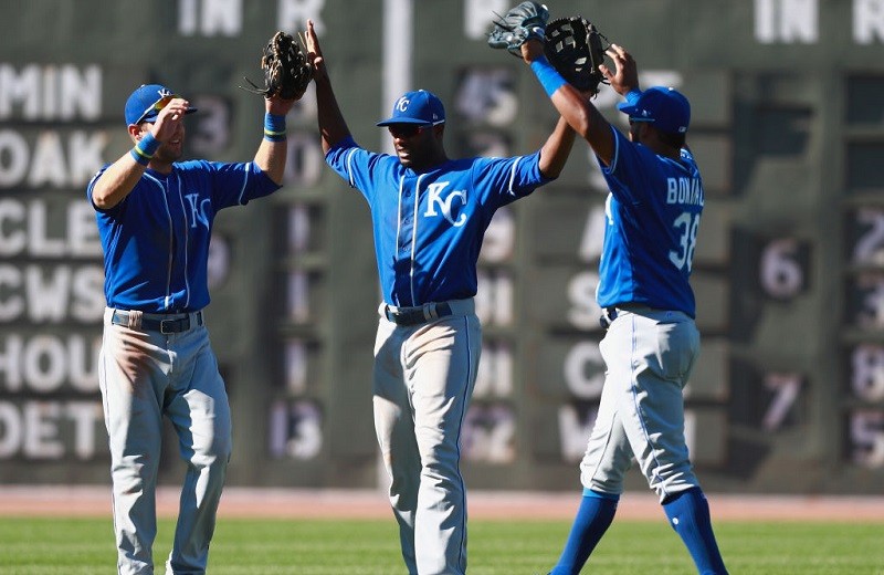 The Royals outfield celebrates a win.