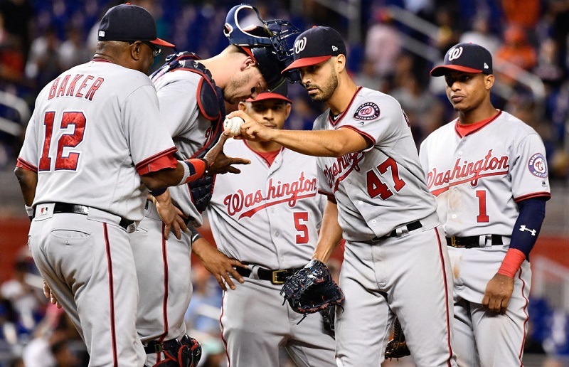Gio Gonzalez #47 of the Washington Nationals gives the ball to Dusty Baker #12 after giving up a no hitter.
