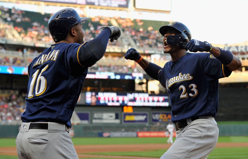 MINNEAPOLIS, MN - AUGUST 07: Domingo Santana #16 of the Milwaukee Brewers congratulates teammate Keon Broxton #23 on a solo home run against the Minnesota Twins during the third inning of the game on August 7, 2017 at Target Field in Minneapolis, Minnesota.