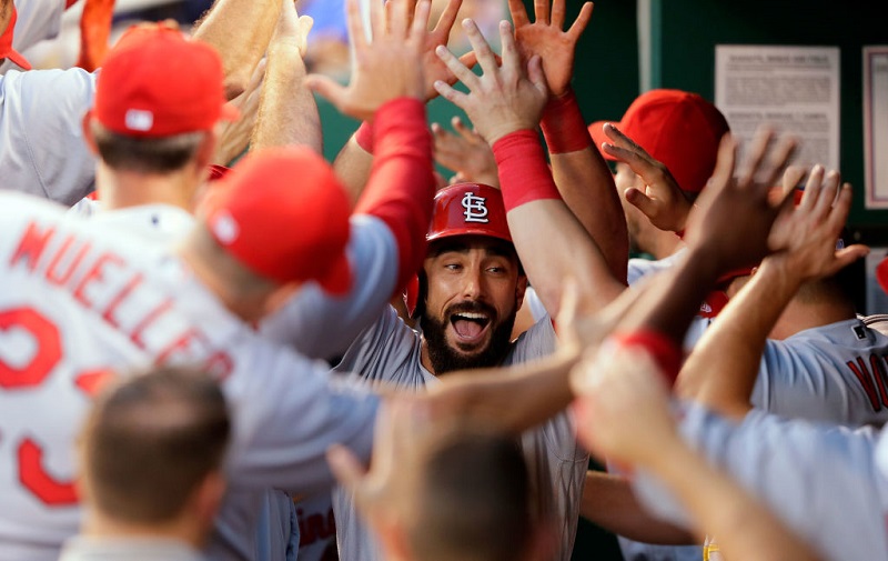 Matt Carpenter celebrates with his Cardinals teammates in the dugout at Kauffman Stadium in 2017.