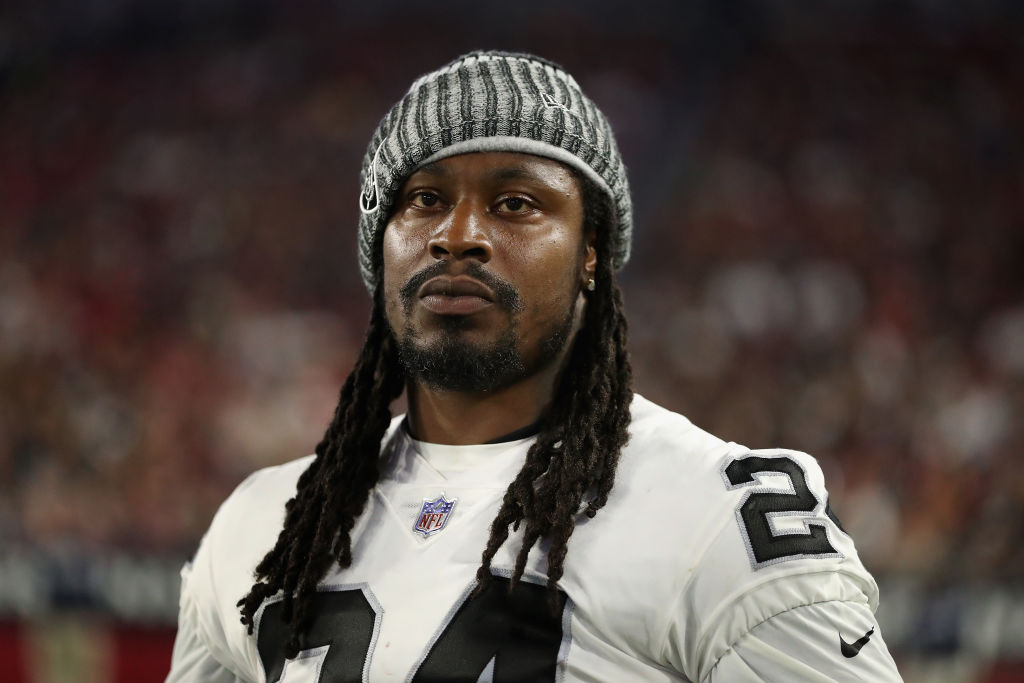 Marshawn Lynch looks concerned on the sideline.
