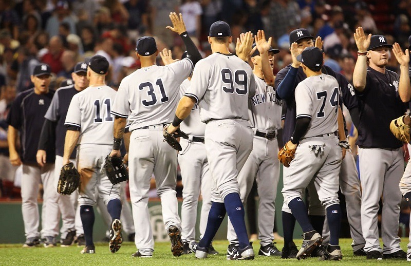 The Yankees celebrate after a victory at Fenway Park on August 19, 2017.