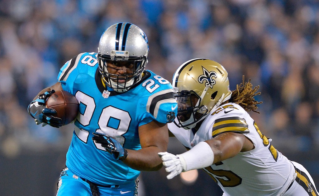 Jonathan Stewart looks to make a play. Jonathan Stewart carries the ball.